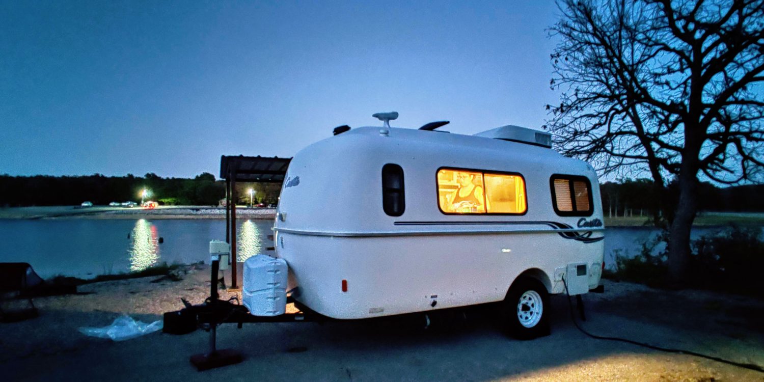 Casita travel trailer at night by Oklahoma's Skiatook Lake