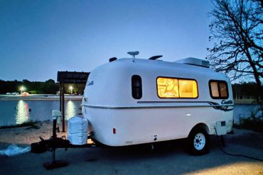 Casita travel trailer at night by Oklahoma's Skiatook Lake