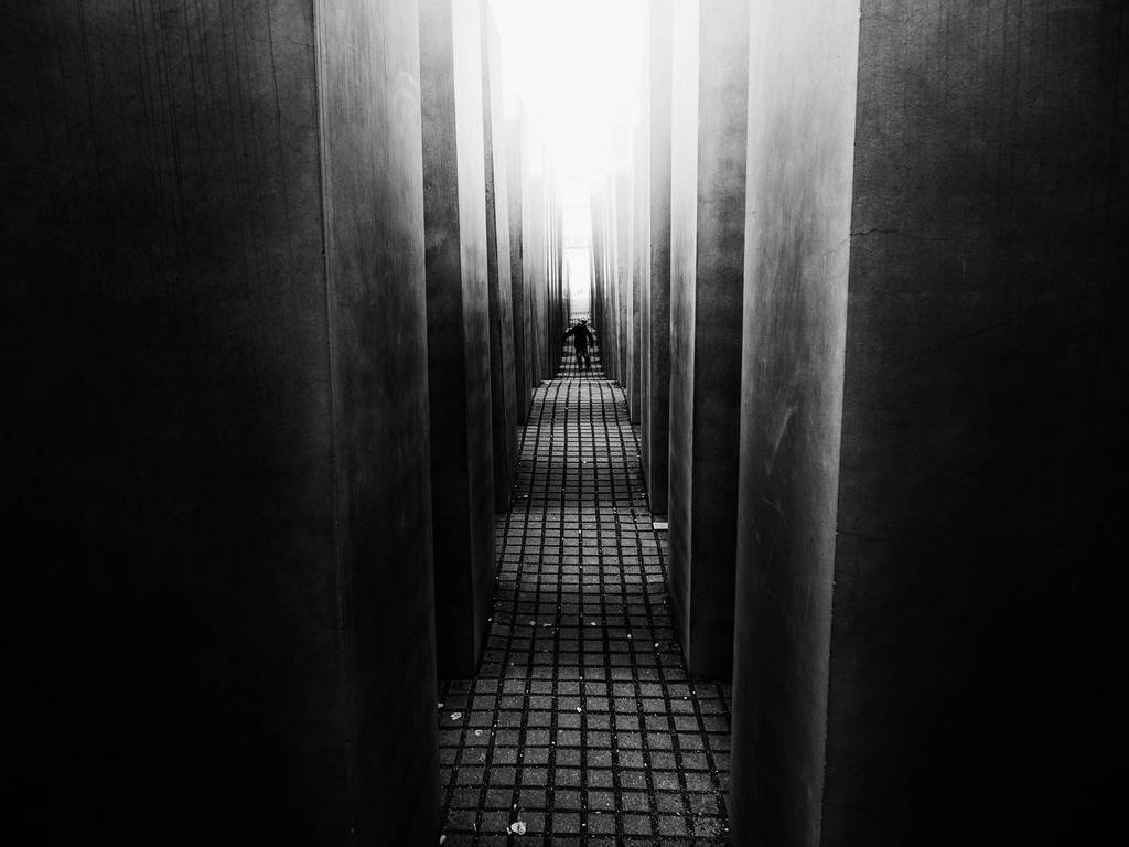 Child wandering inside the Holocaust Memorial, Berlin, Germany