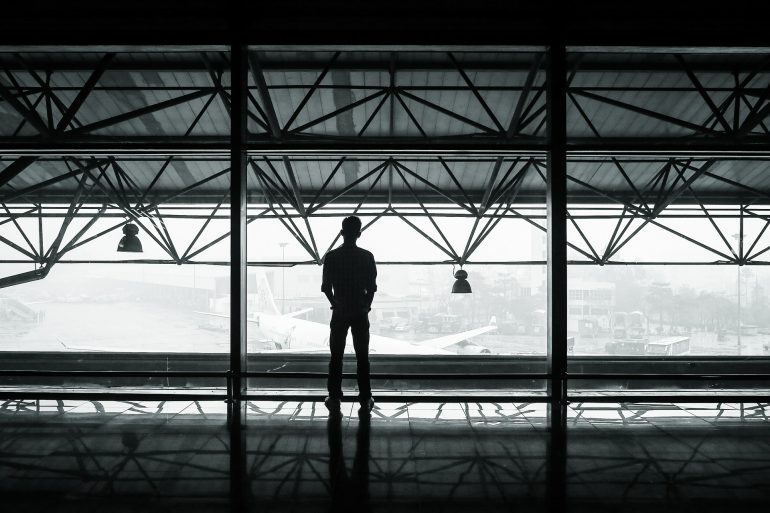 Man in Airport Window