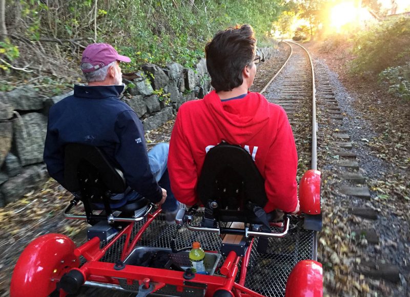 Two men rail biking in Rhode Island